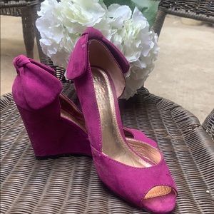 Report sweet looking magenta suede wedge heel